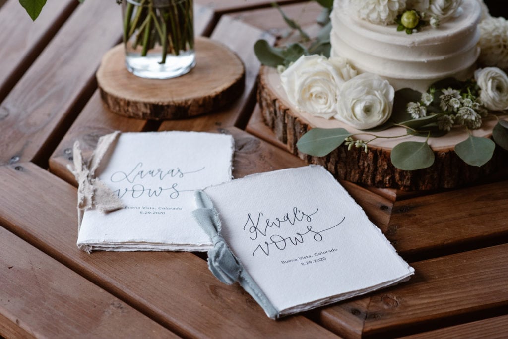 two napkins sitting on top of a wooden table
