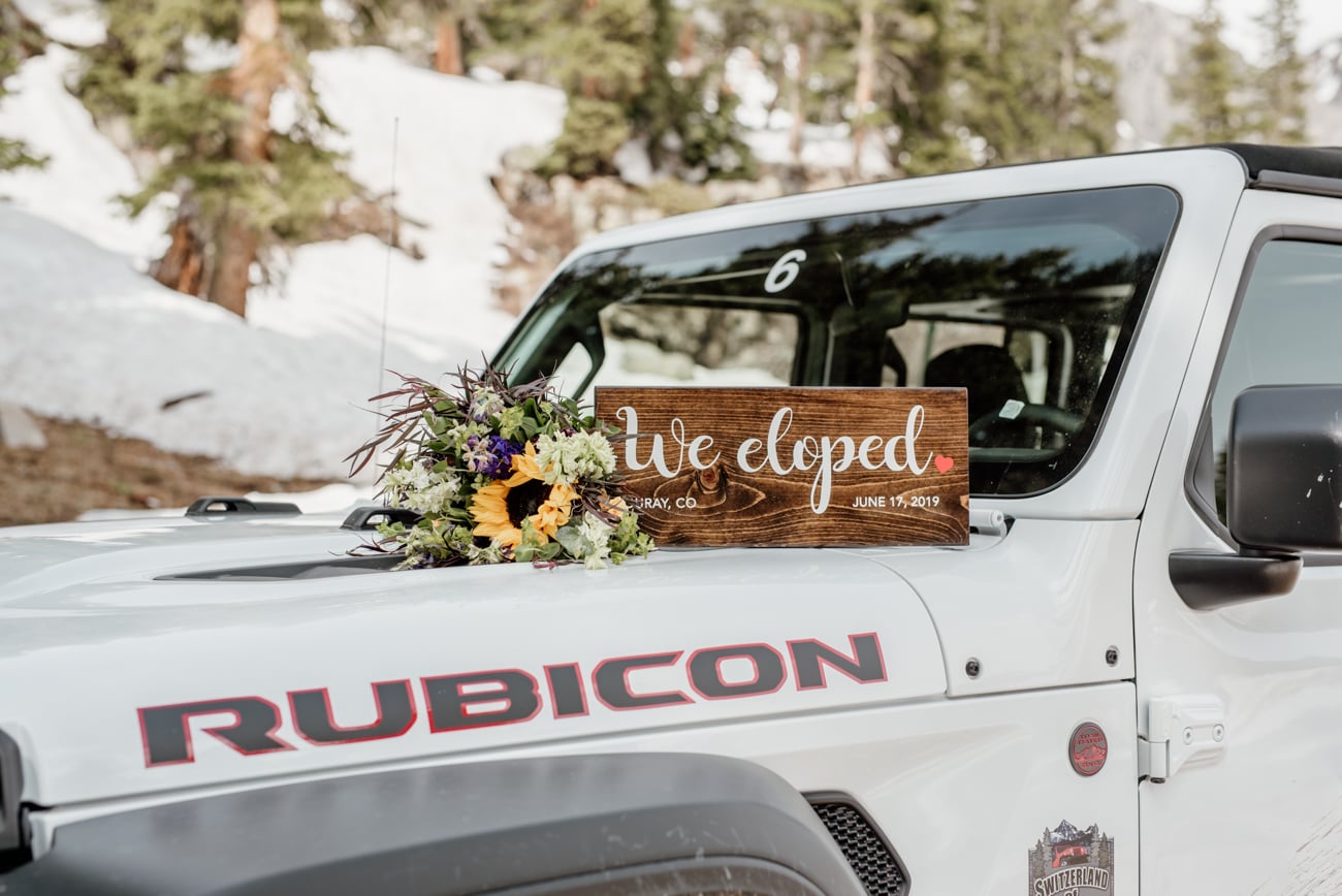 a wedding sign on the back of a truck