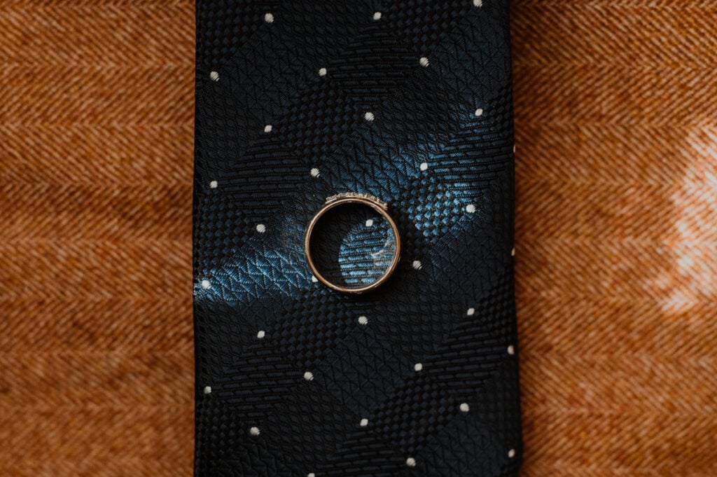 a black tie with a ring on it