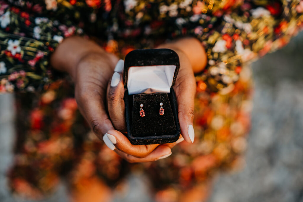 a woman holding a ring in her hand